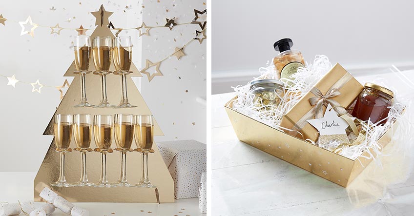Champagner in goldenem Halter und glänzende Geschenkverpackung für edle Weihnachten